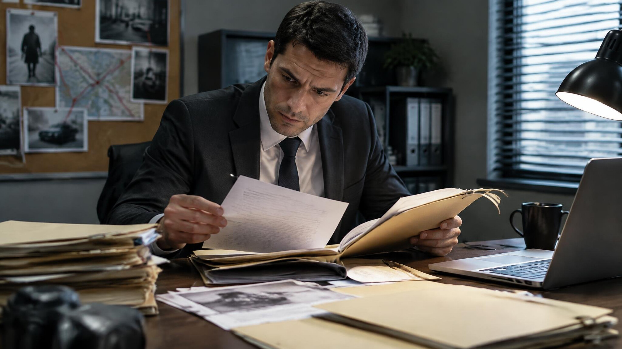 investigator examining documents